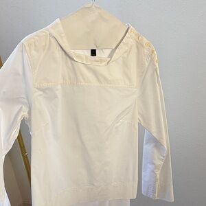 Edgy white top with button detail